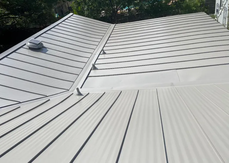 Solar attic fan installed on a metal roof for Roof Ventilation in Chattanooga